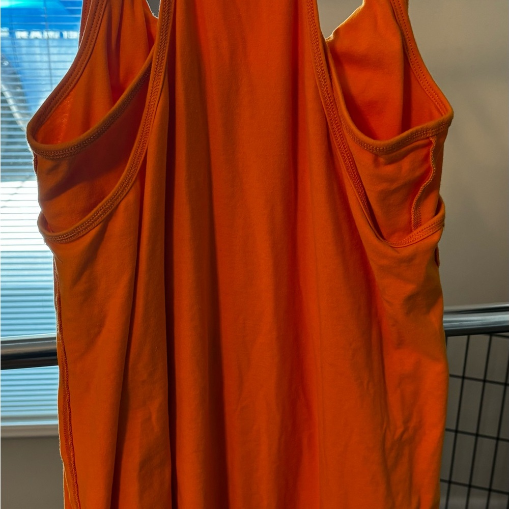 Orange pullover skort dress with spaghetti straps. small size. 2 patch pockets
